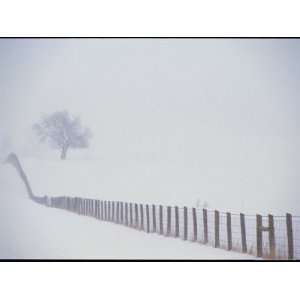 View Along a Wood and Wire Fence Running Across a Snowy Field National 