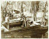 USMC WWII Guam loading injured soldiers on boat  