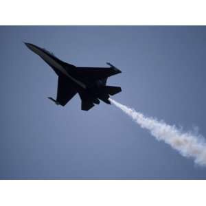  Su27 Russian Jet Fighter Trailing Smoke as It Races Across the Sky 