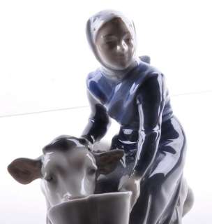 Royal Copenhagen Girl with Calf Porcelain Figurine #779  