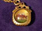 ANTIQUE CATTLE WATCH FOB AND CHAIN  