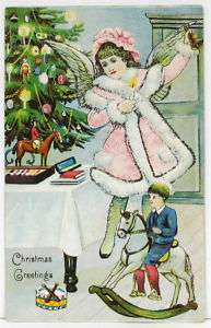   1910s Postcard ~ CHRISTMAS ANGEL wearing Pink ~ Child on Rocking Horse