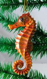   on both front and back Orange Seahorse ornament with string hanger