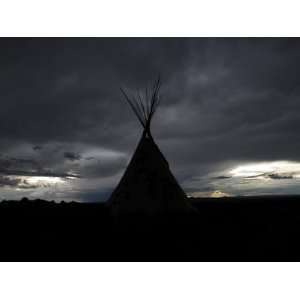  A Tepee Silhouetted Against a Stormy Sky Photographic 