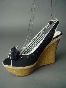 Cork style platform, wedge heel with espadrille accent. Vamp adorned 