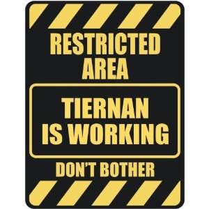   RESTRICTED AREA TIERNAN IS WORKING  PARKING SIGN