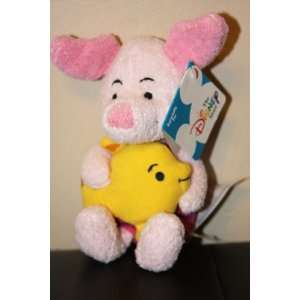    Piglet Holding a Yellow Fish Stuffed Character Toy 