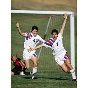  Soccer Players Celebrating after Scoring a Goal 