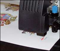 The Craft ROBO Pros ARMS prepares to contour cut a design.