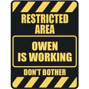   RESTRICTED AREA OWEN IS WORKING  PARKING SIGN