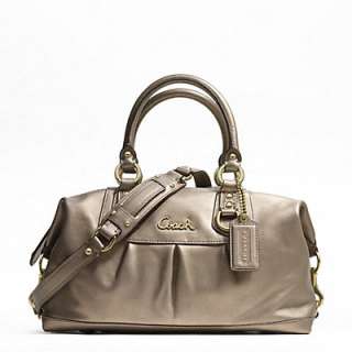   gold hardware coach leather handtag treated to repel water stains