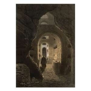 Visitors are Shown the Tombs in the Crypt of San Callisto Church Near 