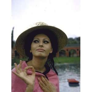  Sophia Loren Wearing a Pink Wrap and Straw Hat Out by the 