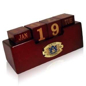   Perpetual wood calendar with universitys logo. NCAA